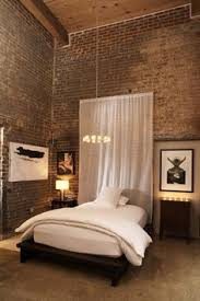 Loft bedroom with exposed brick